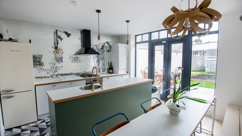 Interior designer Gillian Sherrard got the craftsman who was laying the skirting board to create doors for the kitchen in the former shop on  York Road, Dún Laoghaire. Photograph: Brenda Fitzsimons