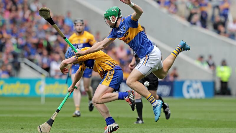 Clare’s Podge Collins with Noel McGrath of Tipperary. Photograph: Morgan Treacy/Inpho