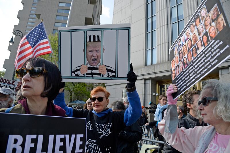  Protesters carrying signs in support of E Jean Carroll  outside Federal District Court for the first day of her civil trial against former president Donald Trump in New York. Photograph: Jefferson Siegel/The New York Times
                      