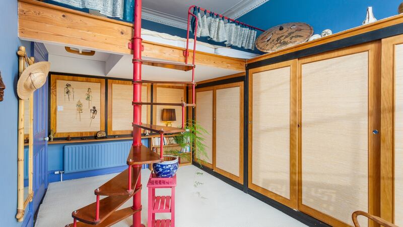 Spiral staircase to the bed in the master bedroom.