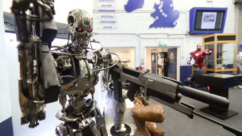 A Terminator replica stands among items seized from a drug lord which are to be auctioned at Wilsons Auctions in Mallusk, Co Antrim. Photograph: Niall Carson/PA Wire