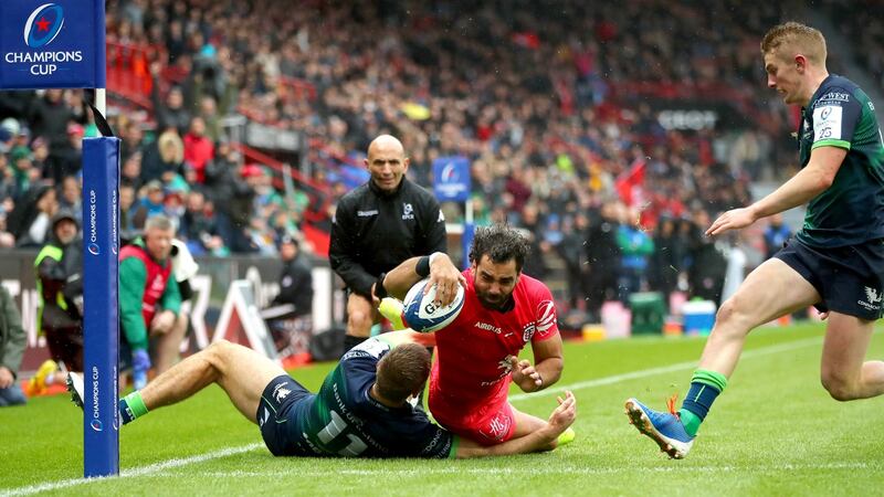 Yoann Huget scores Toulouse’s  second try despite the tackle of Connacht’s Kyle Godwin during the Heineken Champions Cup match at the  Stade Ernest Wallon. Photograph: James Crombie/Inpho