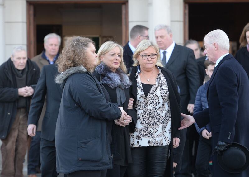 Sinead, Grainne and Orla, daughters of RTÉ Radio presenter Larry Gogan, at the Church of St Pius X, Tempelogue after his funeral Mass on Friday. Photograph: Alan Betson/The Irish Times