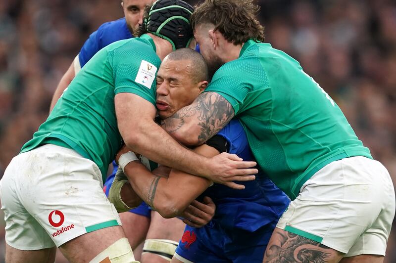 Green wall: France's Gaël Fickou is tackled by Ireland's Caelan Doris and Andrew Porter. Photograph: Brian Lawless/PA
