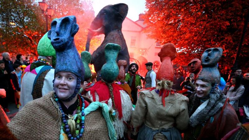 Dancers perform in the Macnas Halloween parade as it passes over the Salmon Weir Bridge this evening. Photograph: Joe O’Shaughnessy