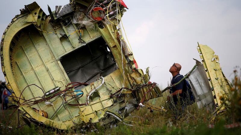 A Malaysian air crash investigator inspects the crash site of Malaysia Airlines Flight MH17, near the village of Hrabove (Grabovo) in Donetsk region, Ukraine. Photograph: Maxim Zmeyev/File Photo/Reuters
