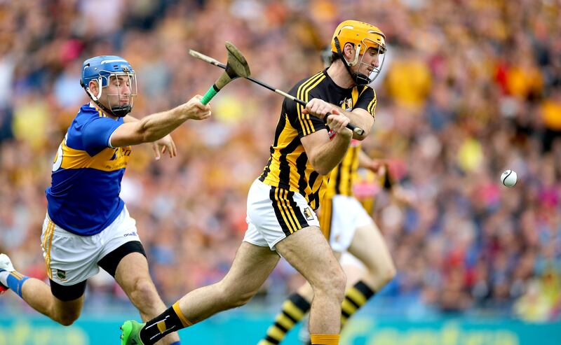 Tipperary’s John McGrath hooks Colin Fennelly of Kilkenny in a 2019 clash. Photograph: James Crombie/Inpho