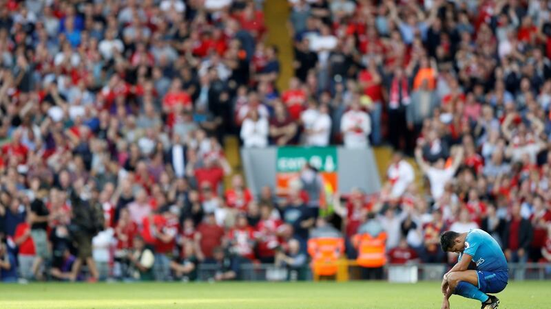 Arsenal’s Alexis Sanchez looks dejected after Liverpool’s Mohamed Salah scores their third goal. Photograph: Carl Recine/Reuters