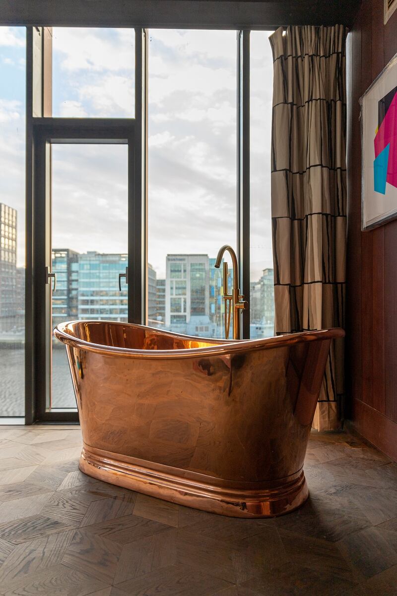 Suites have copper baths in the bedroom.