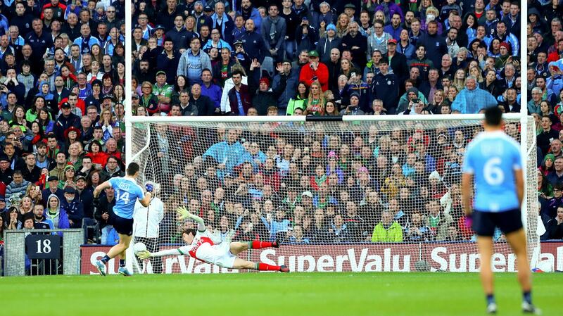 Diarmuid Connolly scores his side’s first goal past goalkeeper David Clarke during the 2016 final replay. Photo: James Crombie/Inpho