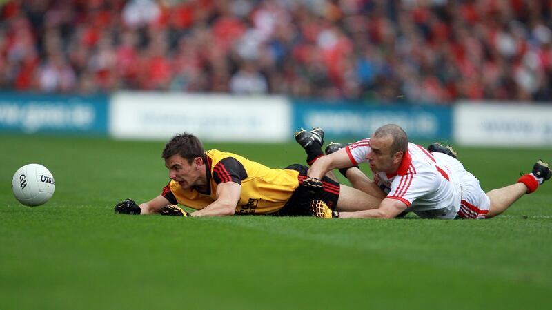 Down’s Danny Hughes tangles with Cork’s John Miskella during the 2010 All-Ireland football final at Croke Park. Photograph: Donall Farmer/Inpho