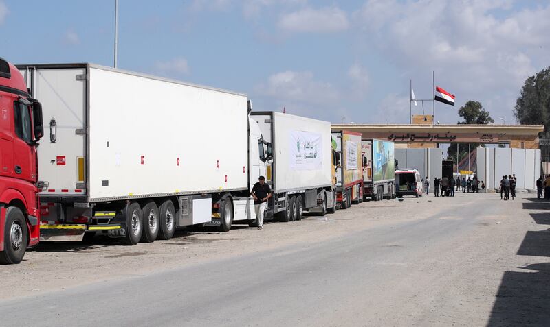 A convoy of trucks carrying humanitarian aid parked outside the border gate between Egypt and Gaza, in Rafah, Egypt, yesterday. Photograph: EPA
