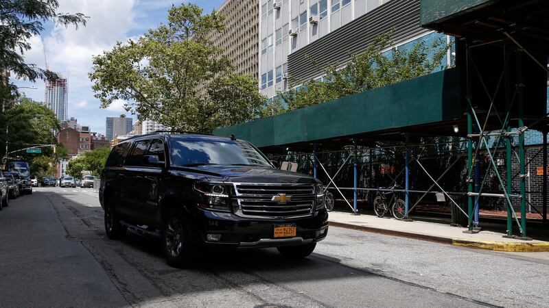 A car reportedly carrying the body of financier Jeffrey Epstein arrives at the chief medical officer’s centre in New York on Saturday.  Photograph: Eduardo Munoz/Reuters