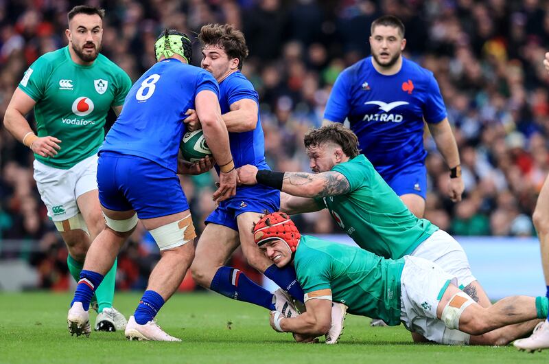 Antoine decked: France’s Antoine Dupont is brought down by Josh van der Flier and Andrew Porter. Photograph: Dan Sheridan/Inpho