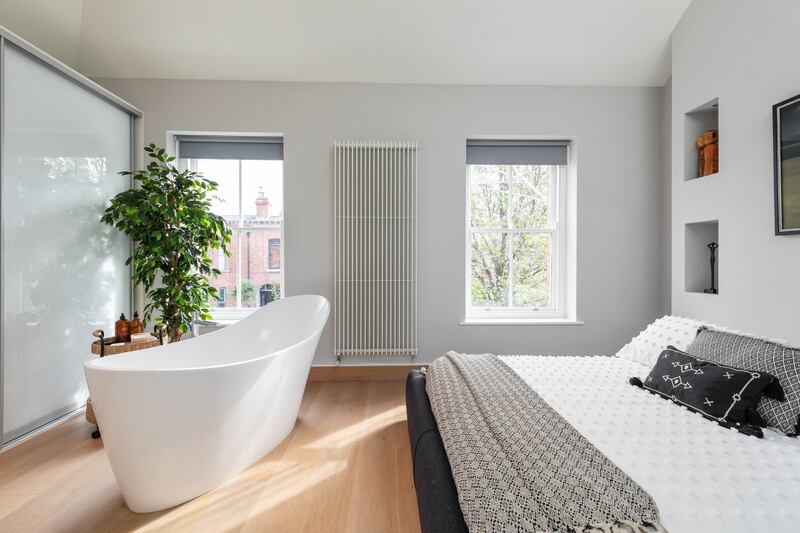 Free-standing bath in the main bedroom