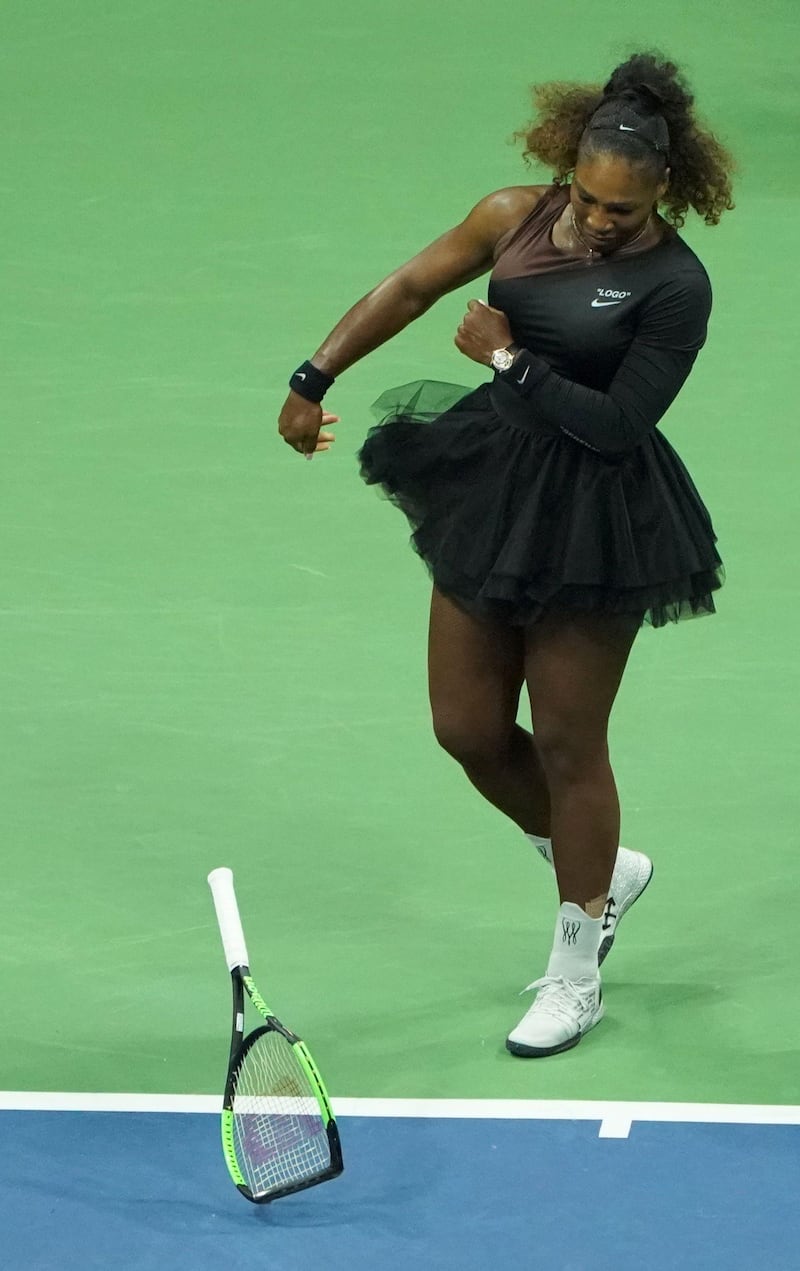 Williams smashes her racket during the match. Photo: Getty Images