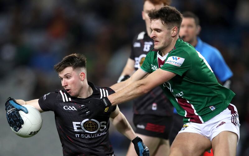 Westmeath's Robbie Forde tackles Peter Fegan of Down. Photograph: Leah Scholes/Inpho