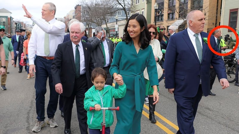 Boston mayor Michelle Wu and Massachusetts governor Charlie Baker marching through the parade, close to   NSC-131 members (circled in red). Photograph: the Boston Globe