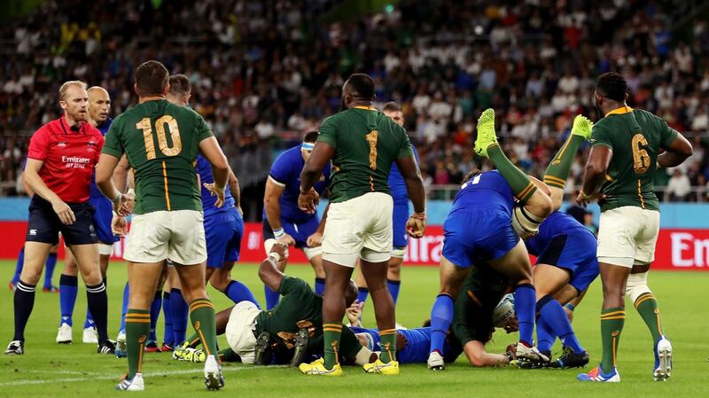 Duane Vermeulen is dumped by Andrea Lovotti of Italy, resulting in the Italian prop being sent a red card. Photograph:  Mike Hewitt/Getty