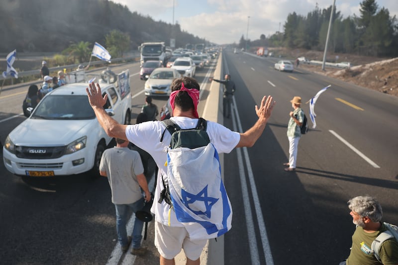 Protesters calling on the Israeli government to end the war in Gaza block the main road connecting Tel Aviv and Jerusalem on Monday. Photograph: Abir Sultan/EPA