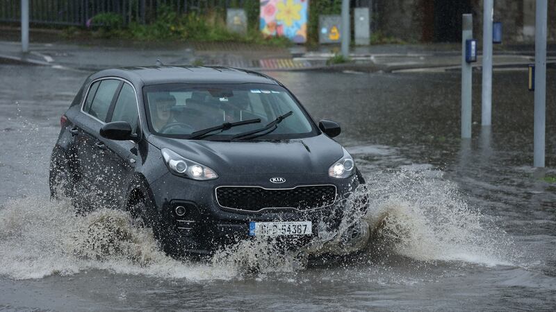 Flash flooding in Dundrum at the junction between the Dundrum bypass and main street. Photograph: Nick Bradshaw/The Irish Times