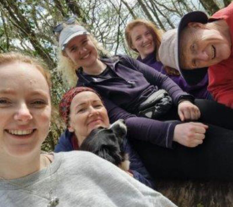 Aisling Finnegan with her younger sister Emer, the new dog Nell, her mum Kate, older sister Orla and her dad Aidan