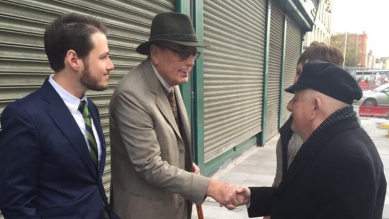 Handshake: Max Loder, Anthony Loder, Noel Scarlett and Bríd Kelly, photographed by Richard De Courcy-Wheeler, grandson of Harry De Courcy-Wheeler