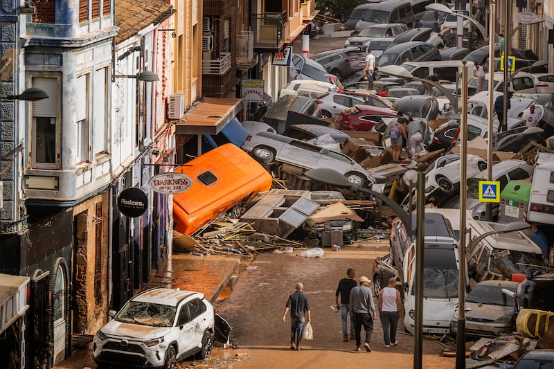 Cars were left piled in the street with other debris after the flooding hit Valencia last October. Photograph: David Ramos/Getty