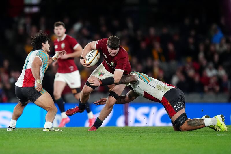 Scott Cummings is tackled by First Nations and Pasifika XV's Darcy Swain. Photograph: David Davies/PA Wire