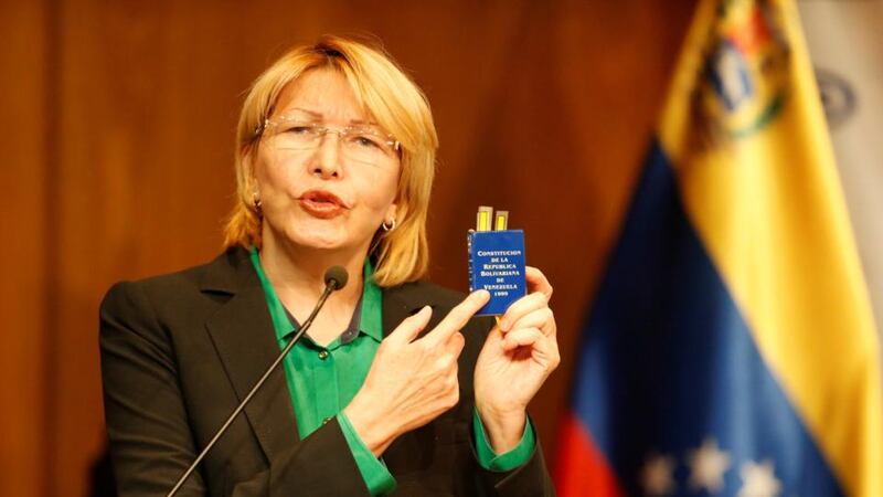 Venezuela’s attorney general: Luisa Ortega holds a copy of the constitution before last weekend’s election. Photograph: Andres Martinez Casares/Reuters