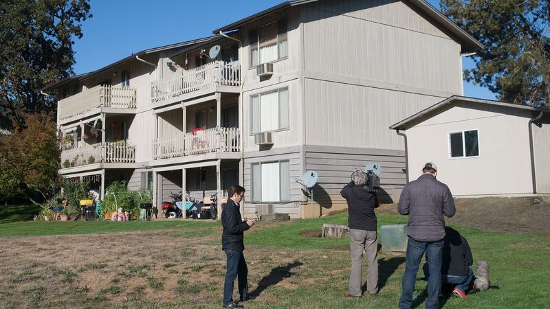 Journalists outside the apartment where Christopher Harper-Mercer lived with his mother, Laurel Harper, in Winchester, Oregon. Harper  said she kept numerous firearms in her home and expressed pride in her knowledge about them, as well as in her son’s expertise. Photograph: Scott Olson/Getty Images