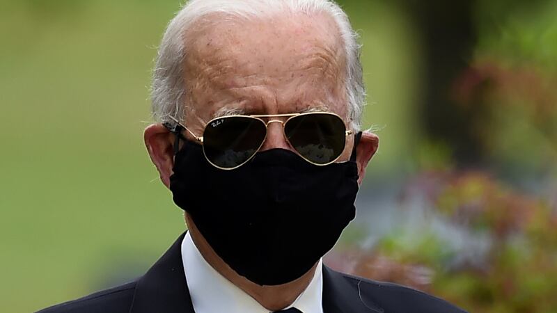 Joe Biden wearing a facemask and shades on Memorial Day. Photograph: Olivier Douliery/Getty/AFP