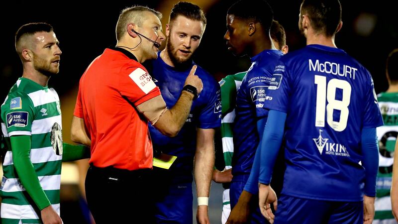 Referee Raymond Matthews sends off Waterford’s Andre Burley. Photograph: Ryan Byrne/Inpho