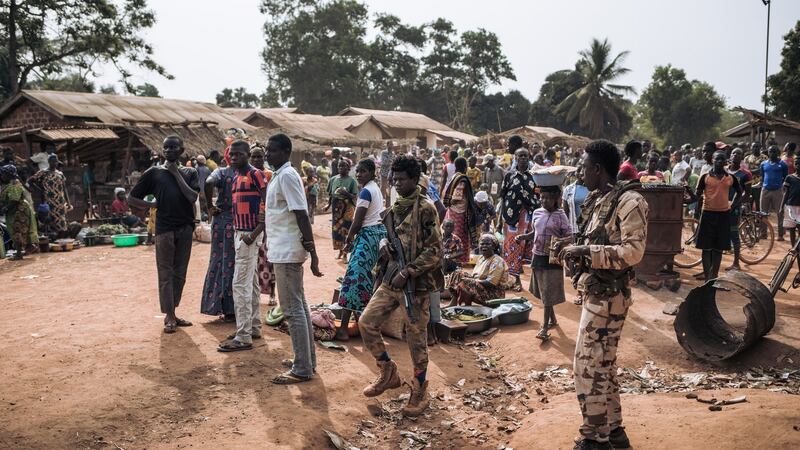 Militiamen of the rebel armed group coalition Coalition of Patriots for Change  patrol in the village of Niakari, which marks the front line with the Central African army and its allies, north of Bangassou, on January 30th last. Photograph:  Alexis Huguet/AFP via Getty Images