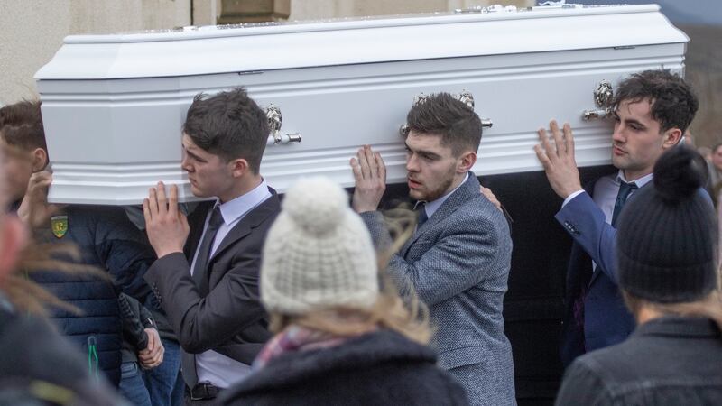 The remains of Mary Ellen Molloy are taken from the Church of the Holy Family in Ardara in west Co Donegal to the adjoining graveyard for burial. Photograph: North West Newspix