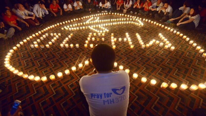 File photograph taken on April 8th, 2014 shows Chinese relatives of passengers on the missing Malaysia Airlines flight MH370 taking part in a prayer service at the Metro Park Hotel in Beijing.  Photograph: AFP/Getty Images