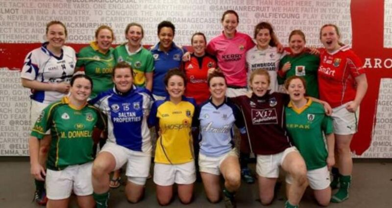 The Ireland Women’s Rugby team decked out in county jerseys, complete with sponsors names, in the tunnel at Twickenham, with the St George’s Red Cross as backdrop