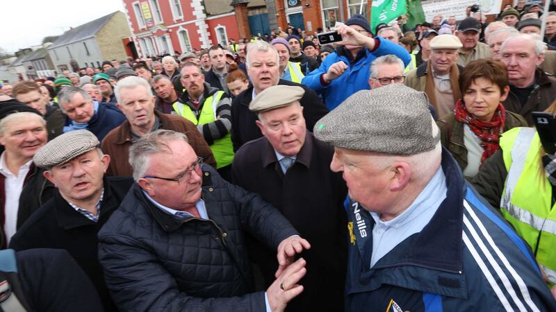 Fianna Fail TD Eugene Murphy is confronted by a protester after addressing the crowd. Photograph: Brian Farrell