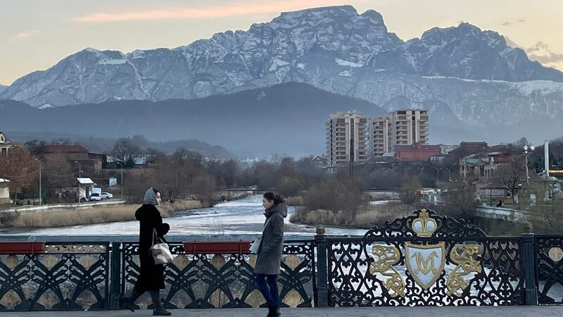 A bridge across the Terek river in central Vladikavkaz, southern Russia, with the Caucasus mountains behind. Photograph: Daniel McLaughlin