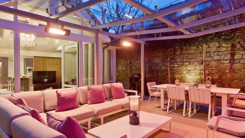Glazed outdoor patio room at night