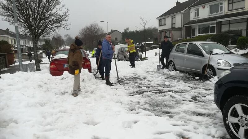 Balinteer locals help ambulance crew members from Donnybrook Fire Station on Sunday. Photograph: Donnybrook Fire Service