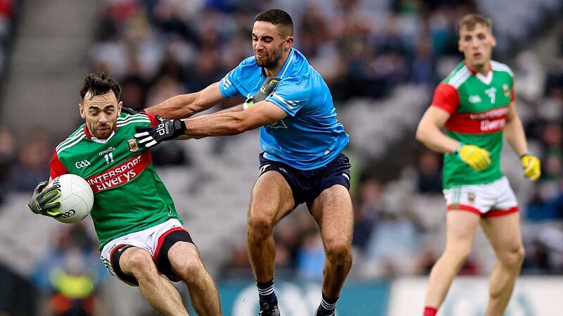 Mayo’s Kevin McLoughlin is challenged by Dublin’s James McCarthy during the All-Ireland semi-final. Photograph: Tommy Dickson/Inpho