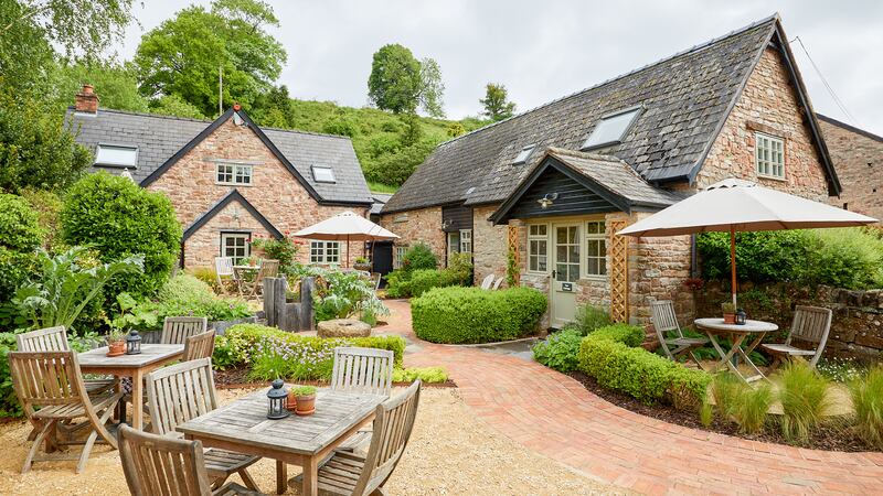 The Tudor Farmhouse, a lovingly restored 13th-century former working farm and hotel in the village of Clearwell