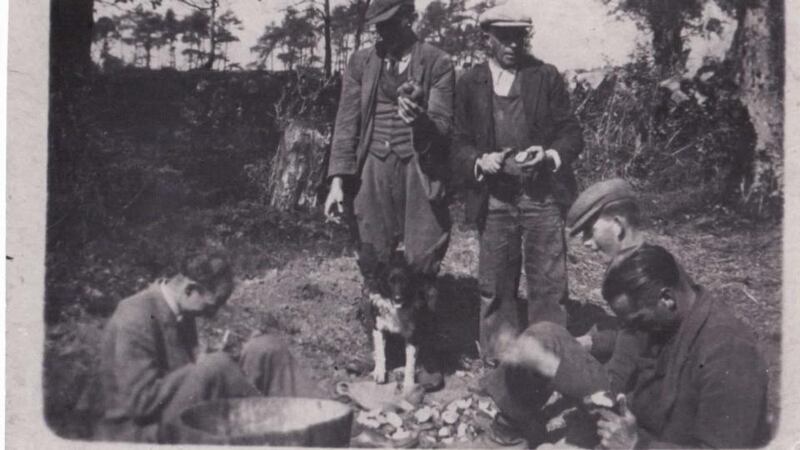 David Thomson, left, working in the fields on the Woodbrook estate, in 1940