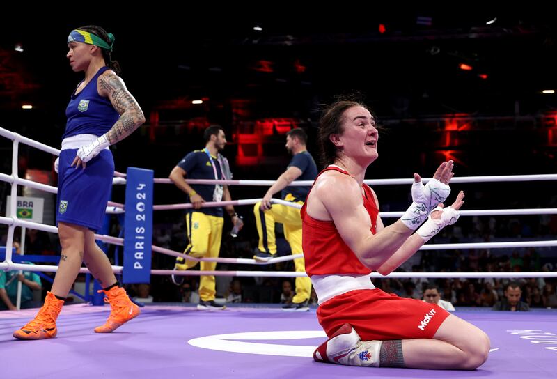 Kellie Harrington sinks to her knees after reaching another Olympic final. Photograph: Richard Pelham/Getty Images