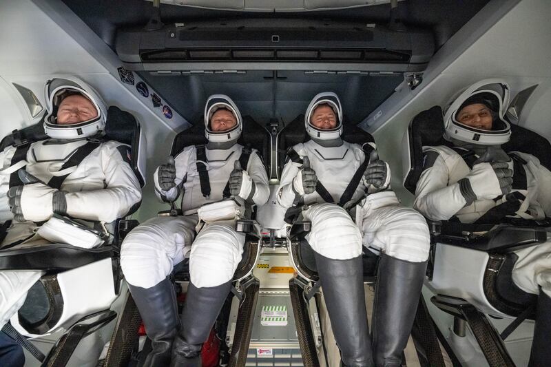 Nasa astronaut Butch Wilmore (left), Roscosmos cosmonaut Aleksandr Gorbunov (second from left), and Nasa astronauts Nick Hague (second from right) and Suni Williams (right) are seen inside a SpaceX Dragon spacecraft onboard the SpaceX recovery ship Megan. Photograph: Keegan Barber/Nasa via Getty Images