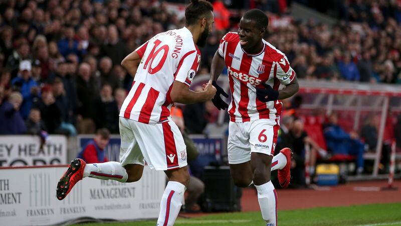 Maxim Choupo-Moting of Stoke City celebrates after scoring his side’s second goal with Kurt Zouma in the Premier League  game against West Brom  at the Bet365 Stadium. Photograph: Alex Morton/Getty Images