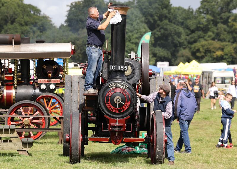 Ivan Glynn polishes his Burrell traction engine from 1917. It has been family-owned since the 1950s and is just through a 12-year restoration process. Photograph: Nick Bradshaw 