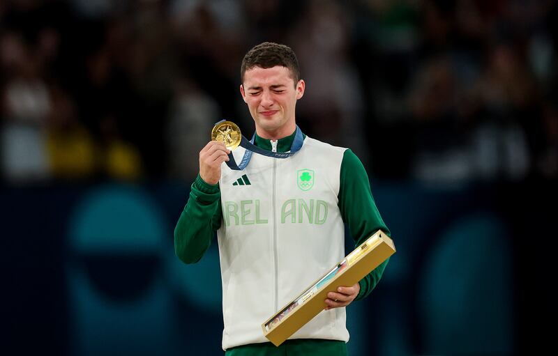 An emotional Rhys McClenaghan celebrates after receiving his gold medal following the men's pommel horse final in Paris. Photograph: James Crombie/Inpho 