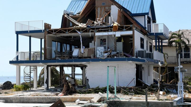 Hurricane Irma’s powerful winds sheared off the side of this Cudjoe Key, Florida, home exposing the inside,Photograph: Taimy Alvarez/South Florida Sun-Sentinel via AP